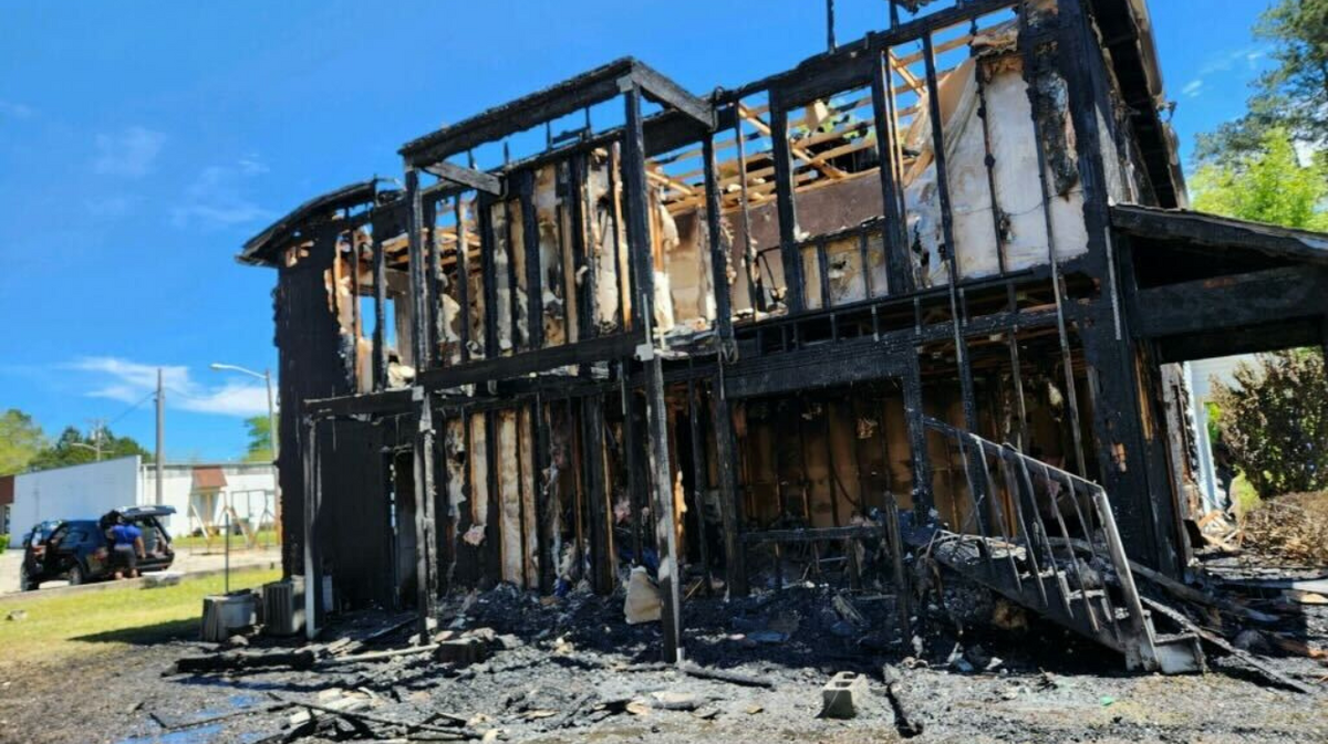 A couple had to toss their 3-year-old from a second-story window to escape a fire in Loris Thursday morning.