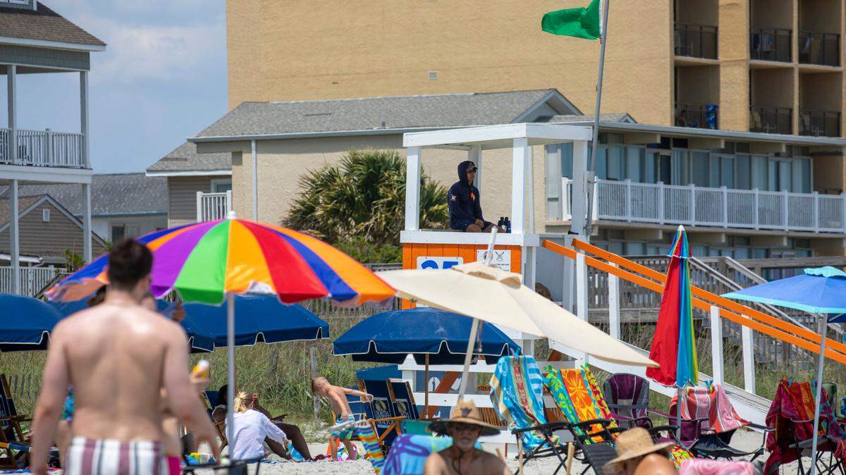A North Myrtle Beach lifeguard watches the ocean on May 31, 2022 in this Sun News file photo. Ocean rescue crews pulled a woman from the water along 15th Avenue N. on Aug. 17, 2022. She later died, authorities said.