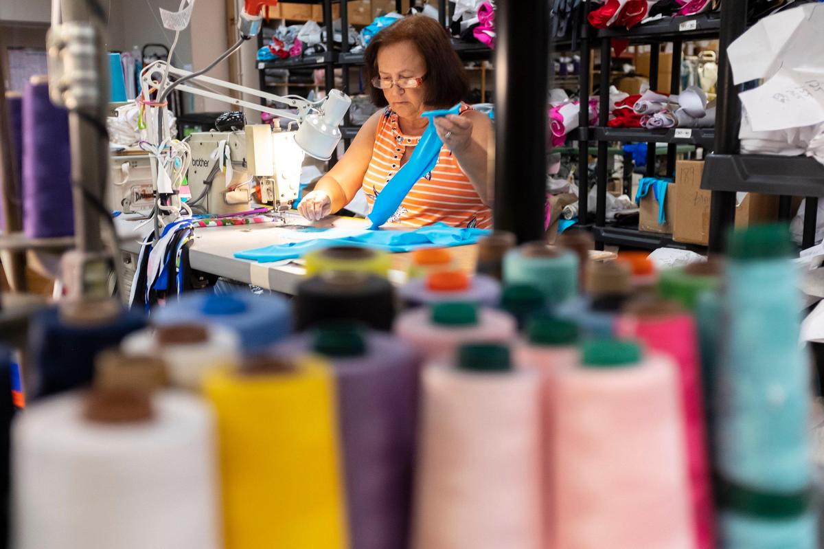 Gail Oliver pieces together a swimsuit before sewing in the Tara Grinna factory in Conway, S.C. on Wednesday, June 13, 2019.