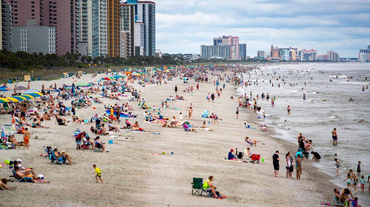 A northbound view of the beach Wednesday afternoon as crowds gather along the coast in Myrtle Beach amidst the coronavirus pandemic.