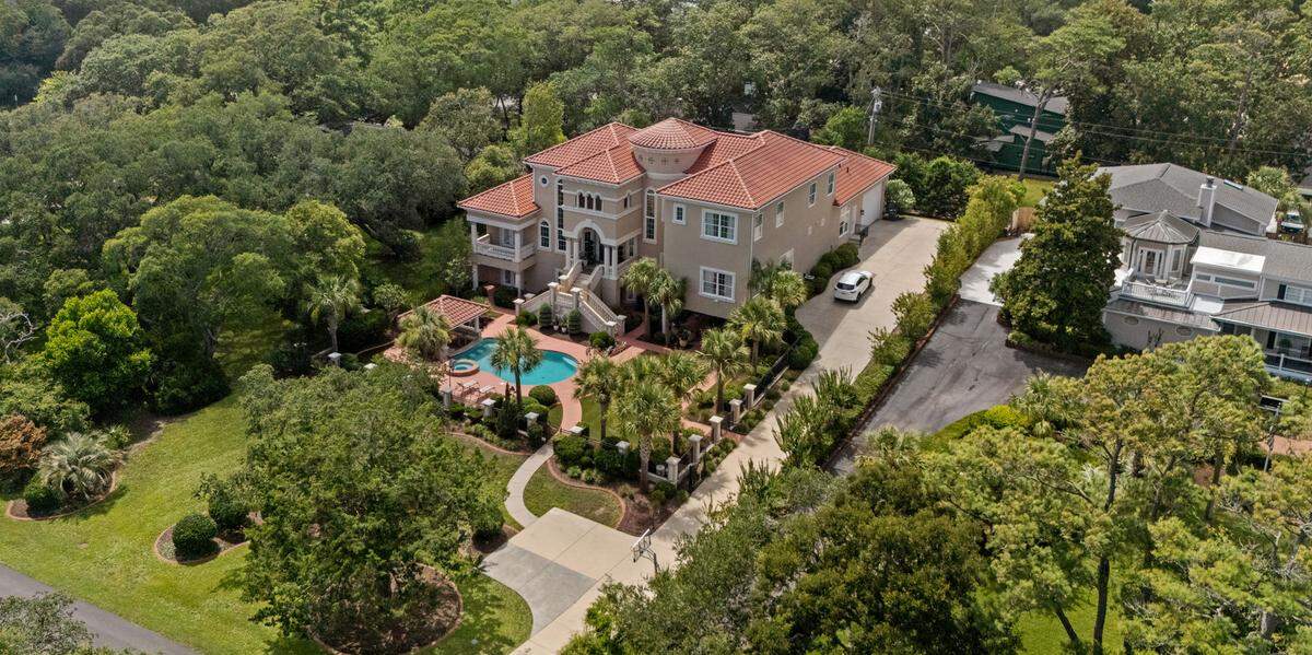 In addition to the mansion’s long driveway, the house has an oversized garage.