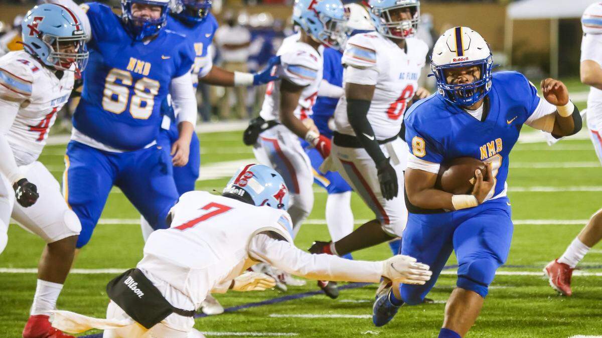 North Myrtle Beach Chiefs Devin Montgomery (8) rushes for a touchdown against the AC Flora Falcons during the first half the state championship game at Benedict College.