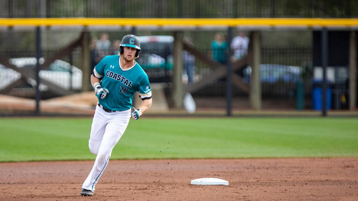 Coastal Carolina first baseman Zach Biermann rounds the bases after hitting a home run against N.C. State at Springs Brooks Stadium on Feb. 24.