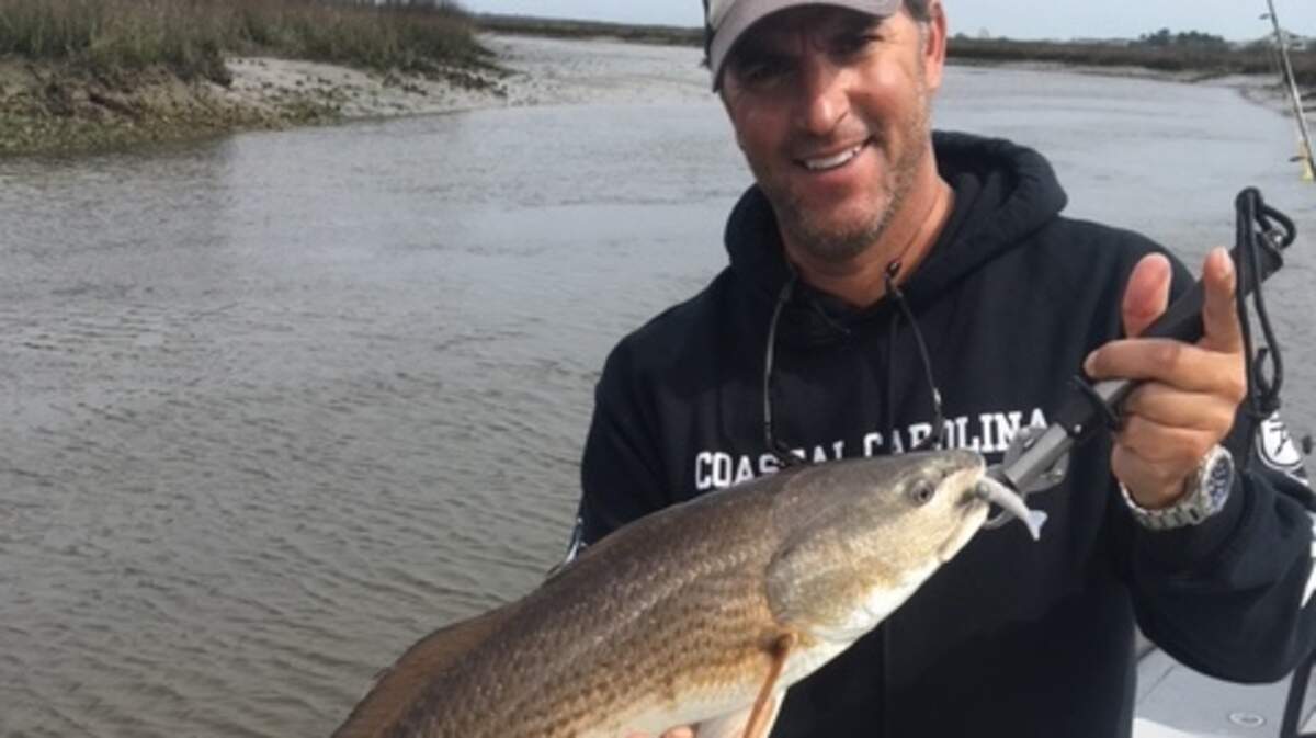 Capt. Patrick Kelly of North Myrtle Beach, owner/operator of Captain Smiley Fishing Charters, prepares to release a red drum on a recent fishing trip. New limits on red drum appear imminent, pending approval of Gov. Henry McMaster.
