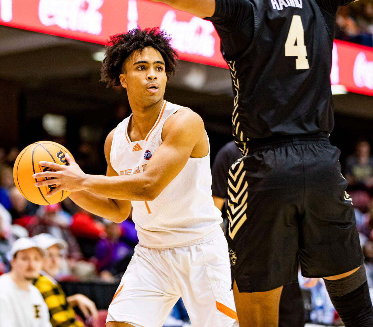 Mercer junior guard Kamar Robertson looks to pass against West Carolina junior forward Marlow Gilmore Friday night during the SoCOn Ingle Basketball Championships at the Harrah’s Cherokee Center in Asheville, N.C.