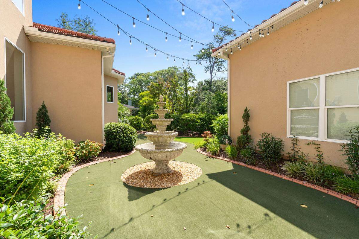 The resort-style backyard comes complete with a private putting green.