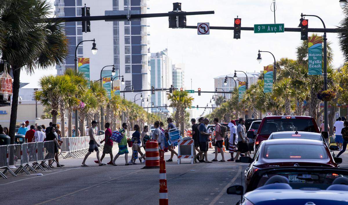 Though barricades were in place, this Saturday of Memorial Day weekend looked much different from years past. With Bike Fest postponed, family groups, some wearing masks walked Ocean Boulevard. May 23, 2020