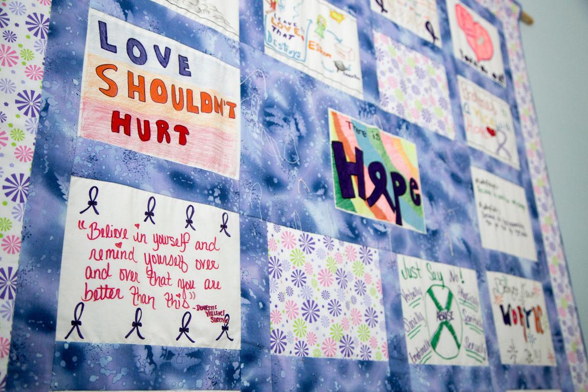 A domestic violence quilt hangs in a conference room at the Family Justice Center of Georgetown and Horry Counties in Georgetown, S.C. on June 6, 2018.