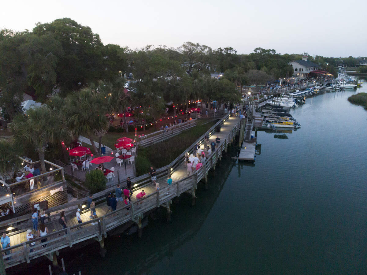 People stroll the Murrells Inlet Marsh Walk on Saturday evening. With hotels, beaches, shopping and restaurants reopening along the Grand Strand, tourist season kicked off this weekend despite coronavirus concerns. May 16, 2020
