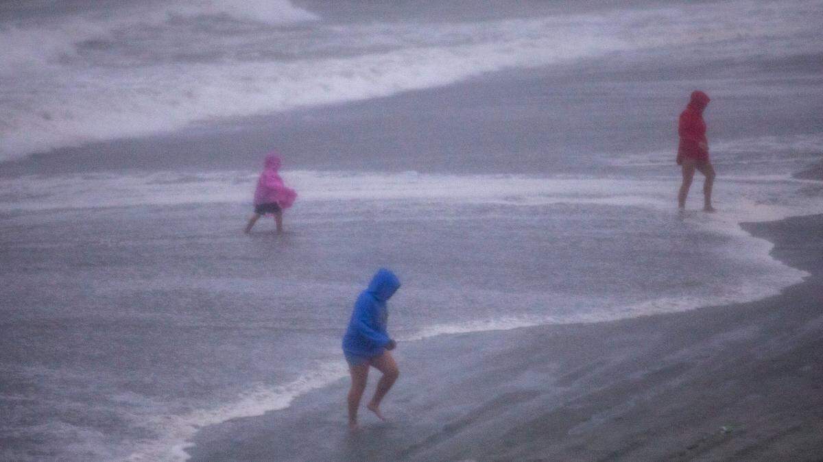 Local and tourists ventured onto the beach in Garden City Beach to watch the arrival of Tropical Storm Isaias. The storm lashed Myrtle Beach on Monday evening with wind, rain and waves. Arriving with a king tide, the coastal communities along the Grand Strand were flooding Monday night. August 3, 2020.