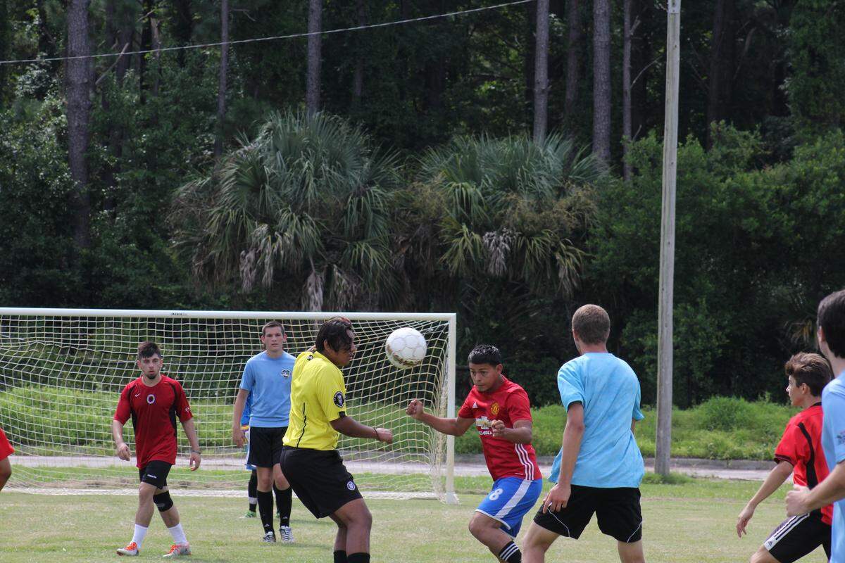 The Legends soccer team (in red) beat the Chicago FB (in blue) during a charity soccer tournament raising money to send soccer equipment to kids in Costa Rica and Nigeria.