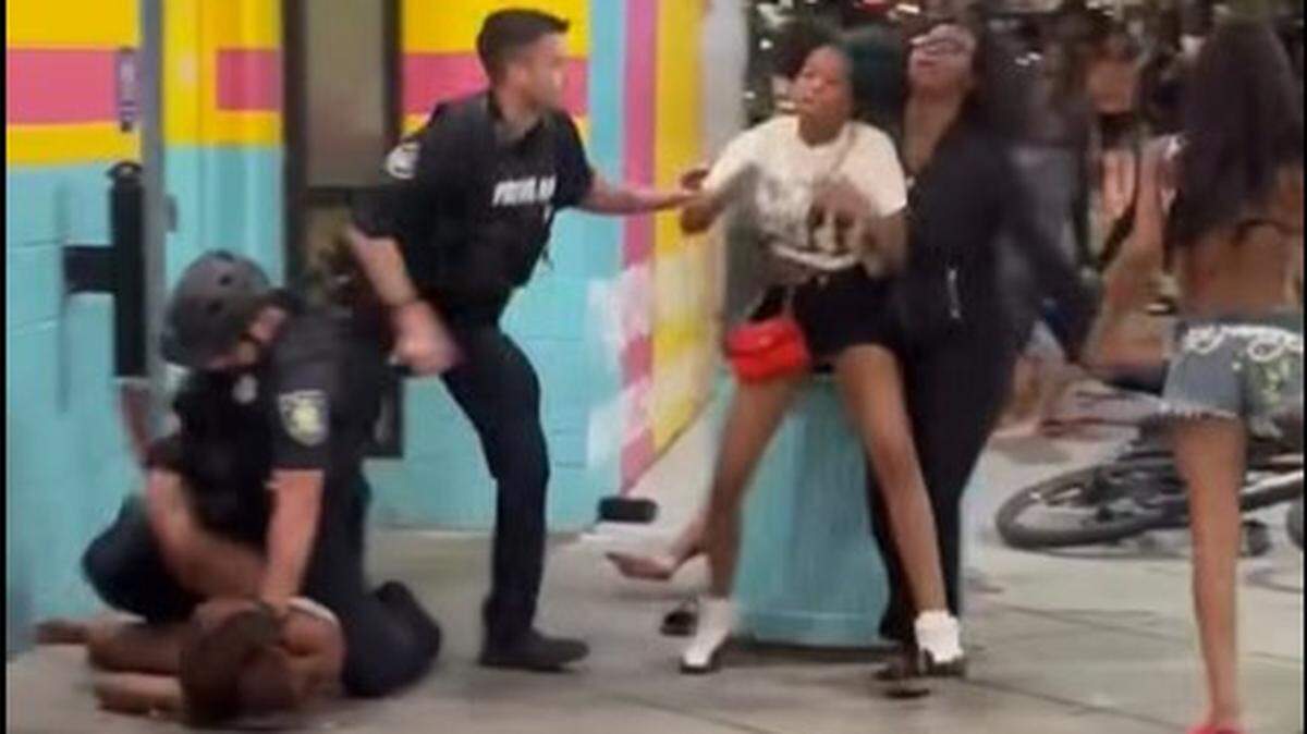 A video shows Myrtle Beach Police officers attempting to break up a large fight Saturday, April 11, 2026, along the tourist section of Ocean Boulevard in downtown Myrtle Beach, SC. Three people have been arrested in the incident.