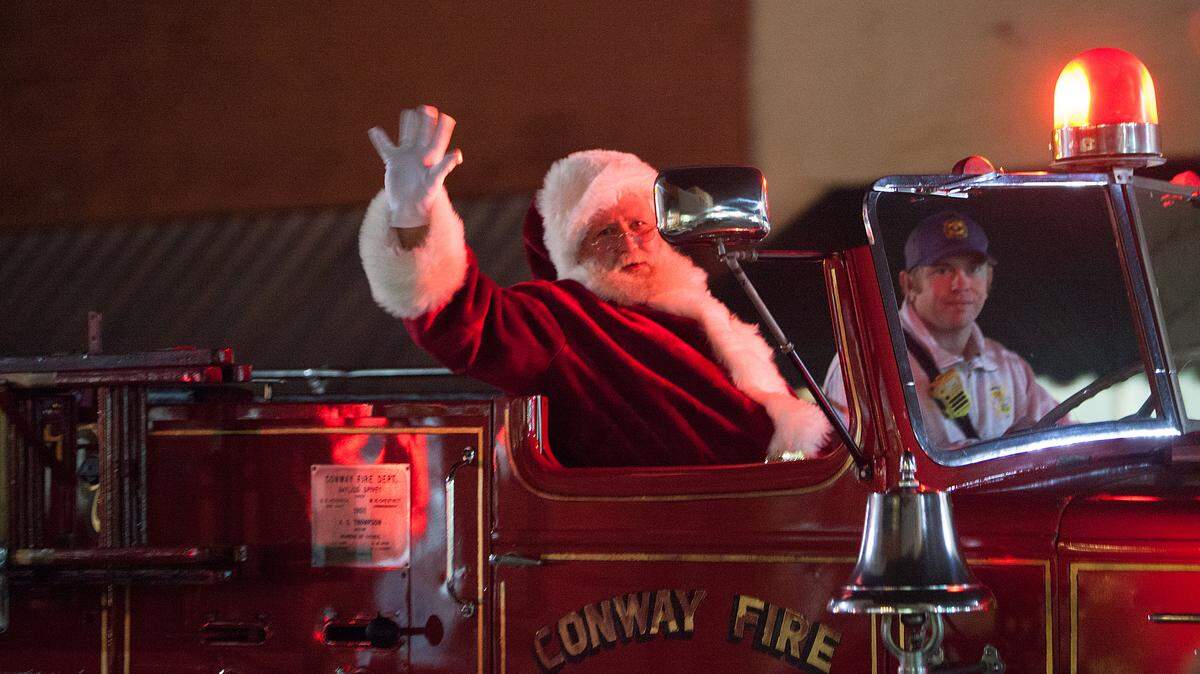 Santa is transported through Conway in a Conway Fire Department truck in this file  photo.