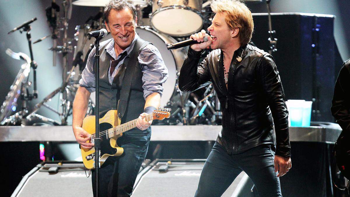 This image released by Starpix shows Bruce Springsteen, left, and Jon Bon Jovi performing at the 12-12-12 The Concert for Sandy Relief at Madison Square Garden in New York on Wednesday, Dec. 12, 2012. Proceeds from the show will be distributed through the Robin Hood Foundation. (AP Photo/Starpix, Dave Allocca)