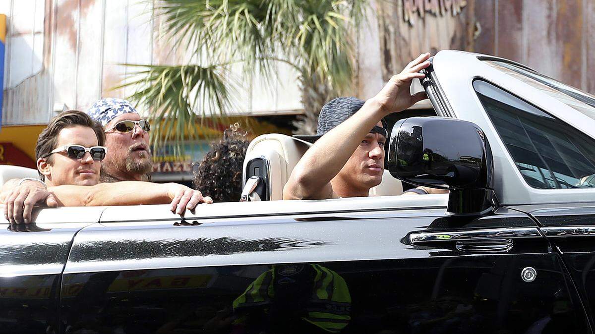 The stars of "Magic Mike XXL" cruise Ocean Boulevard in a Rolls Royce in this 2014 file photo.