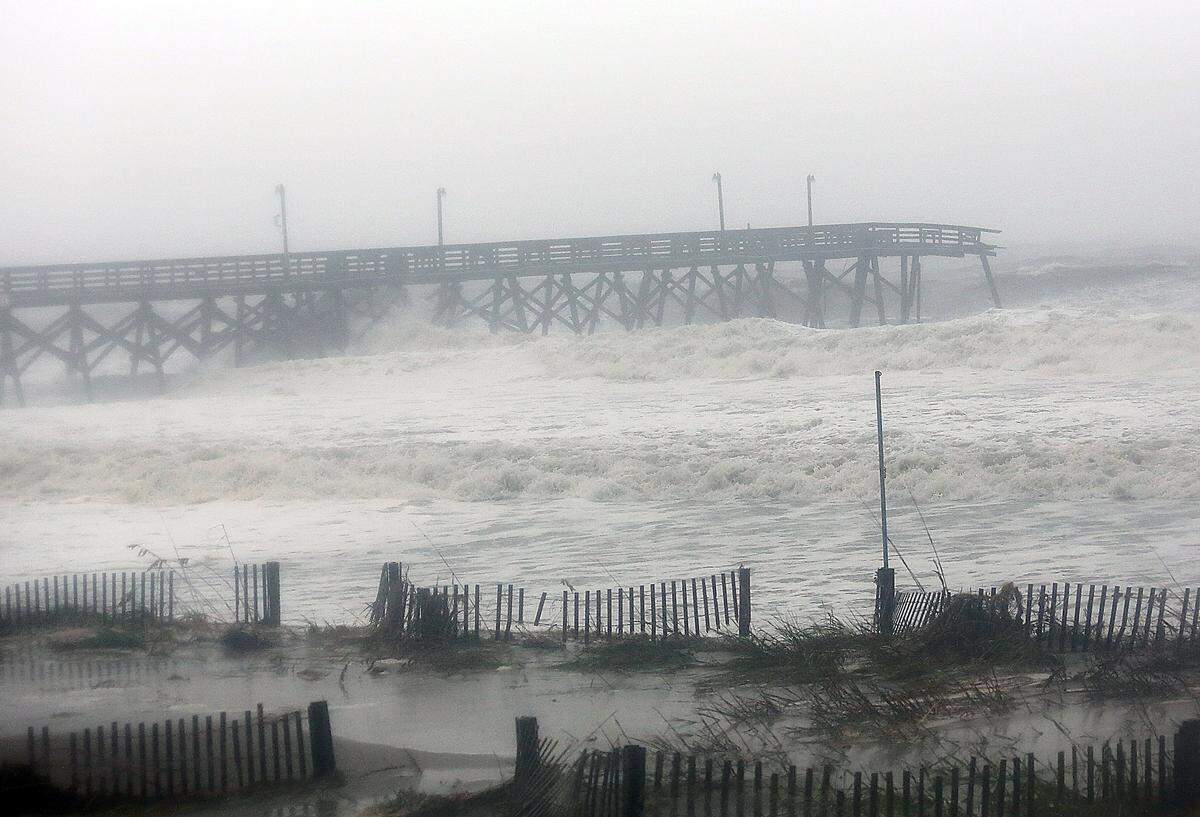 Surfside Beach Pier is snapped off on Saturday, Oct. 8, 2016, as high tide comes in and Hurricane Matthew goes north.