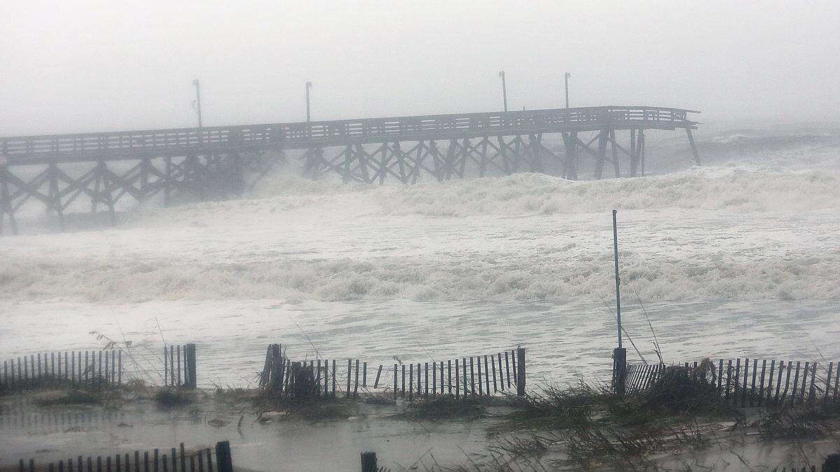 Surfside Beach Pier is snapped off on Saturday, Oct. 8, 2016, as high tide comes in and Hurricane Matthew goes north.
