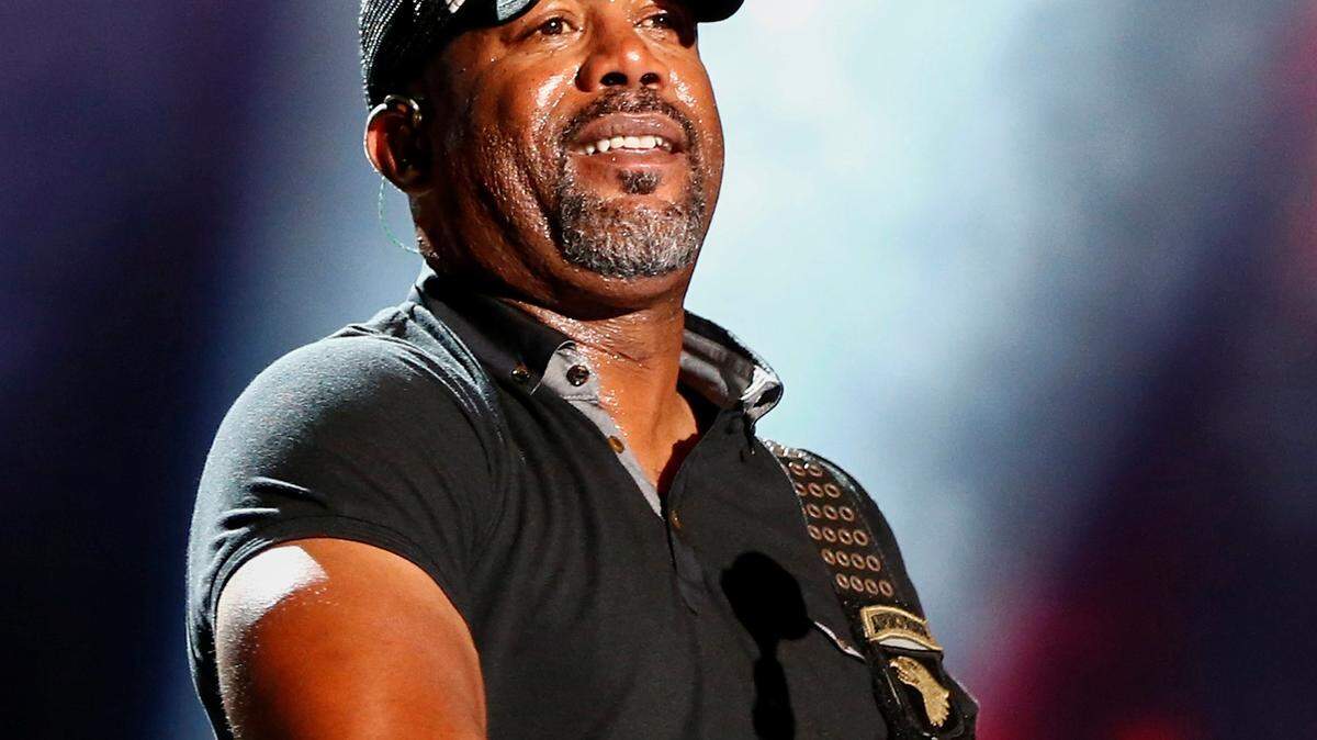 FILE - In this June 14, 2015 file photo, Darius Rucker performs at the CMA Music Festival in Nashville, Tenn. Mainstream country music has been quietly distancing itself from the Confederate flag for years, but as the debate reignites following a massacre at a black church in South Carolina on June 17, country artists still struggle to articulate their feelings about the flag’s history and symbolism. (Photo by Al Wagner/Invision/AP, File)