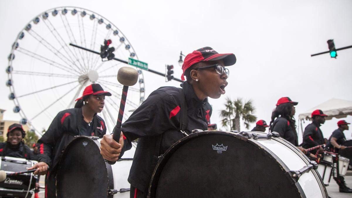 The Prem1er Community Drumline from Georgetown, SC performs during the Martin Luther King Jr. day parade in Myrtle Beach. 
The 11th Annual Dr. Martin Luther King Jr. Freedom Rally Weekend came to a close on Monday with a celebration and awards breakfast at the Myrtle Beach Convention Center and a parade down Ocean Boulevard. 
Weekend events were sponsored by the Carolina African American Heritage Foundation (CAAHF), the City of Myrtle Beach, and the Myrtle Beach Area Chamber of Commerce. Jan. 16, 2017.