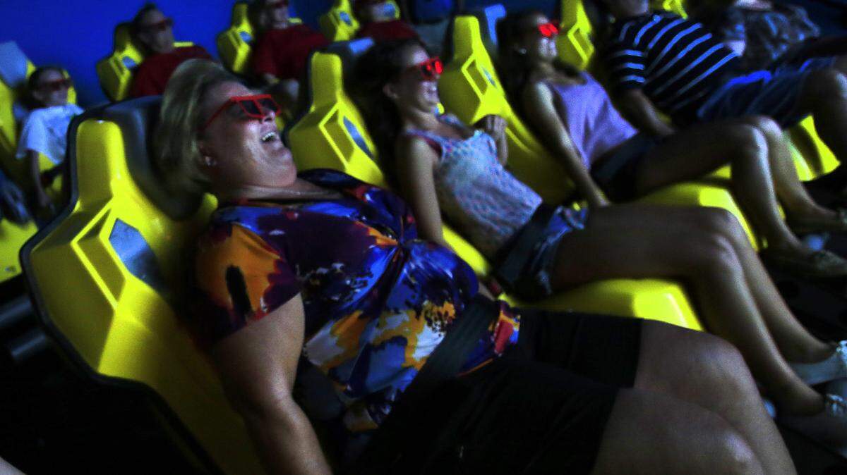 Riders try to new 6D Motion Ride, one of the new rides and exhibits have been added at WonderWorks at Broadway at the Beach.