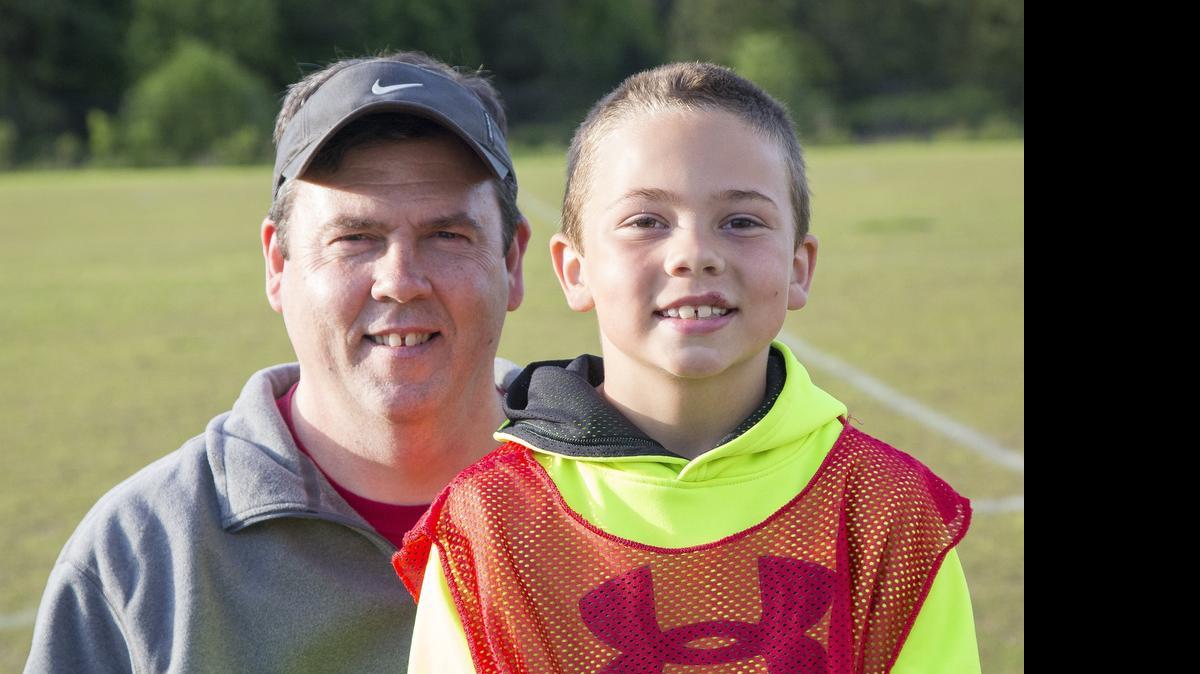 
Lucas Mullen coaches his son, Patrick’s, soccer team at the YMCA. Mullen, a partner at Coastal Vacation Rentals, was adopted. He was spurred into searching for his biological parents when he saw how much his children looked like him.
