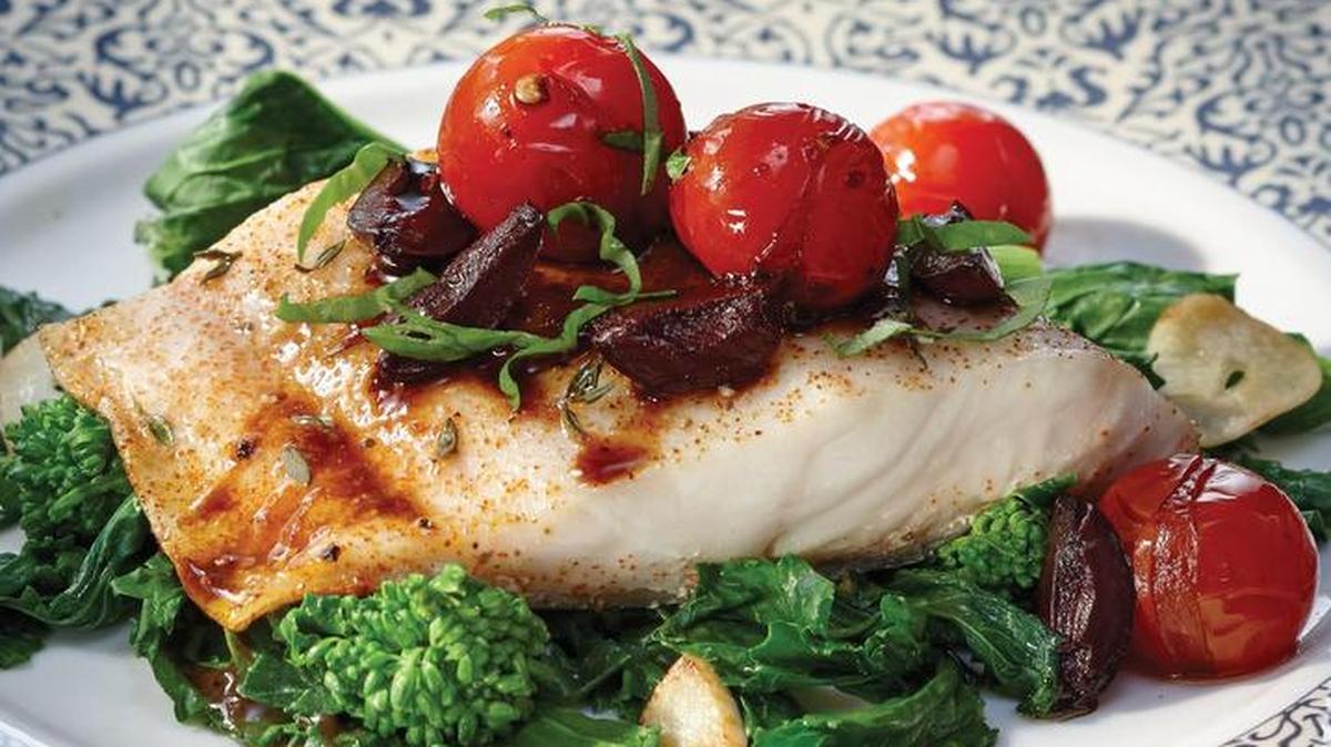 Roasted black cod with Warm Tomato Vinaigrette served on Seared Rapini