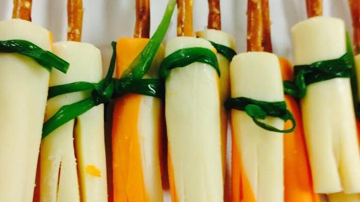 Witches Broomsticks - pretzel sticks with string cheese (cut to look like broom bristles) and tied with green onion