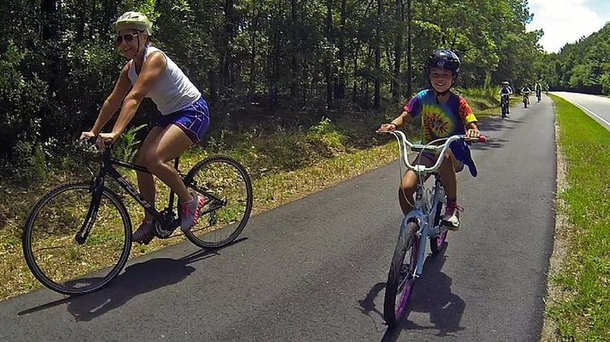 About 75 people took part in the family bike ride after the ribbon cutting ceremony for the newest three-mile section of the Waccamaw Neck Bikeway.