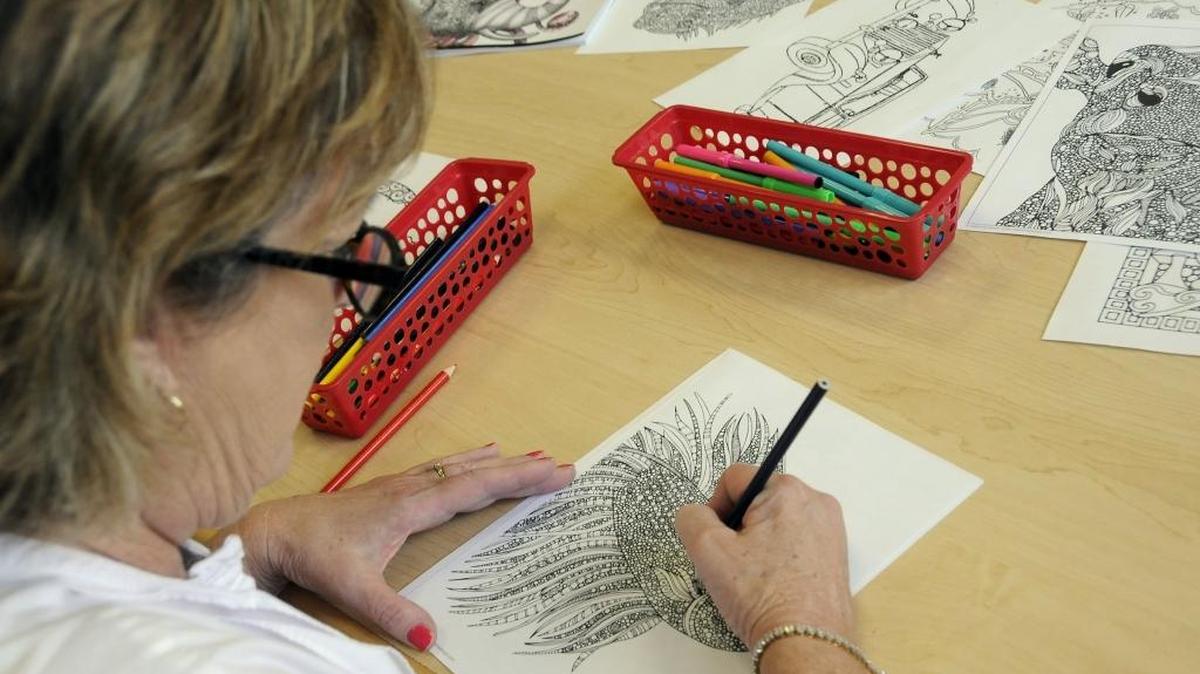
This fish being colored by Becky Adams is a great example of the intricate patterns featured in some adult coloring books. The Carolina Forest Library has artists pencils, markers and books available on Monday evenings for people who want to try the popular new activity. “It’s a great way to relieve stress after a hard day at the office,” said Adams.
