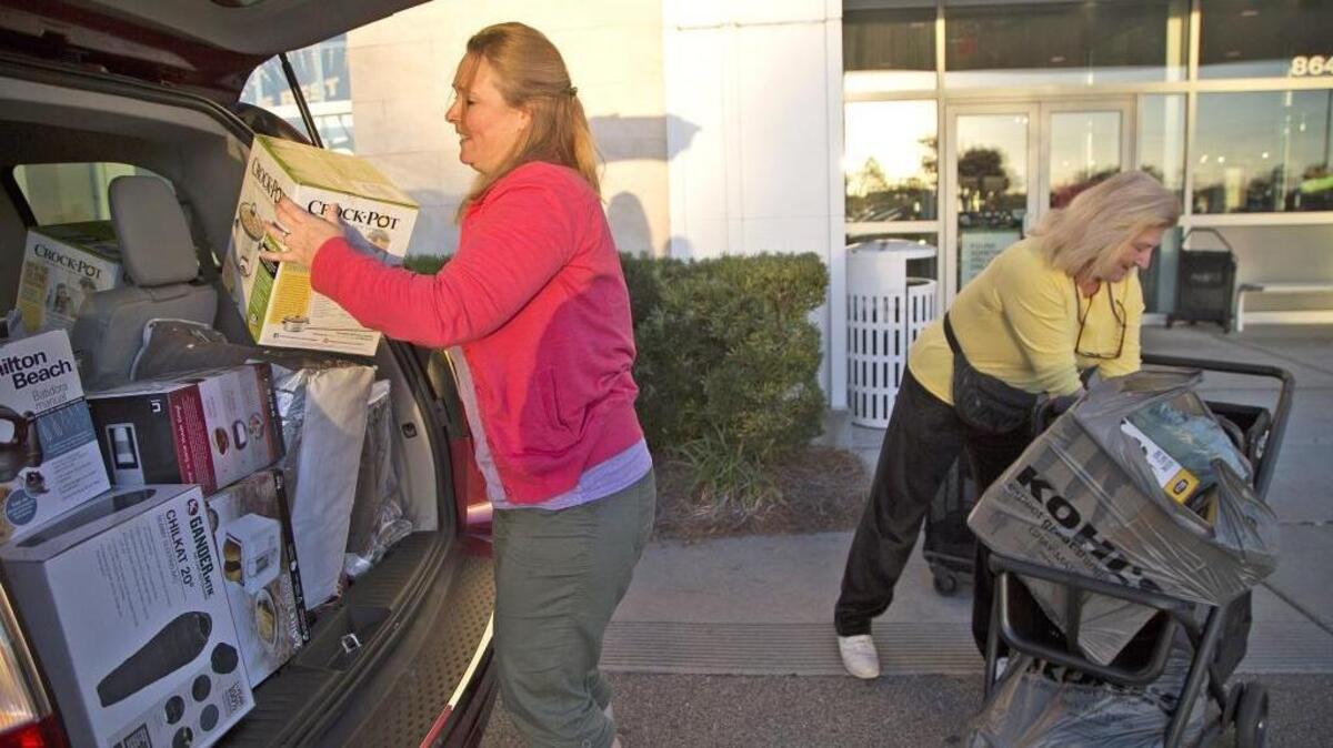 Kimberly Sachs and Nellie Koontz part-time residents of Myrtle Beach from Maryland, fill their van with discount home goods that they say they will use to stock their rental properties.