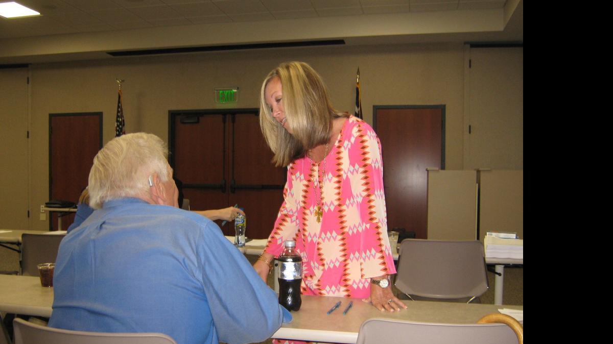 
Sandy Davis, director of operations and project management for the Myrtle Beach Regional Economic Development Corp., talks with Horry County Councilman Gary Loftus at a recent EDC meeting.
