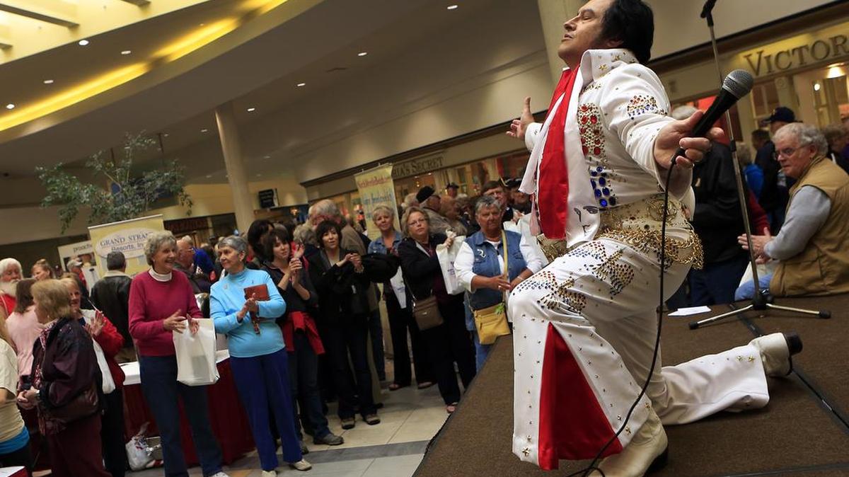 
Elvis artist “King Shazaam” performs at a snowbird reception in 2013 at Myrtle Beach Mall. The Myrtle Beach Area Chamber of Commerce has arranged for discounts for Canadian visitors at some hotels, attractions and restaurants from January through April to make up for the exchange rate. A Canadian dollar is worth only about 75 cents in U.S. currency. 
