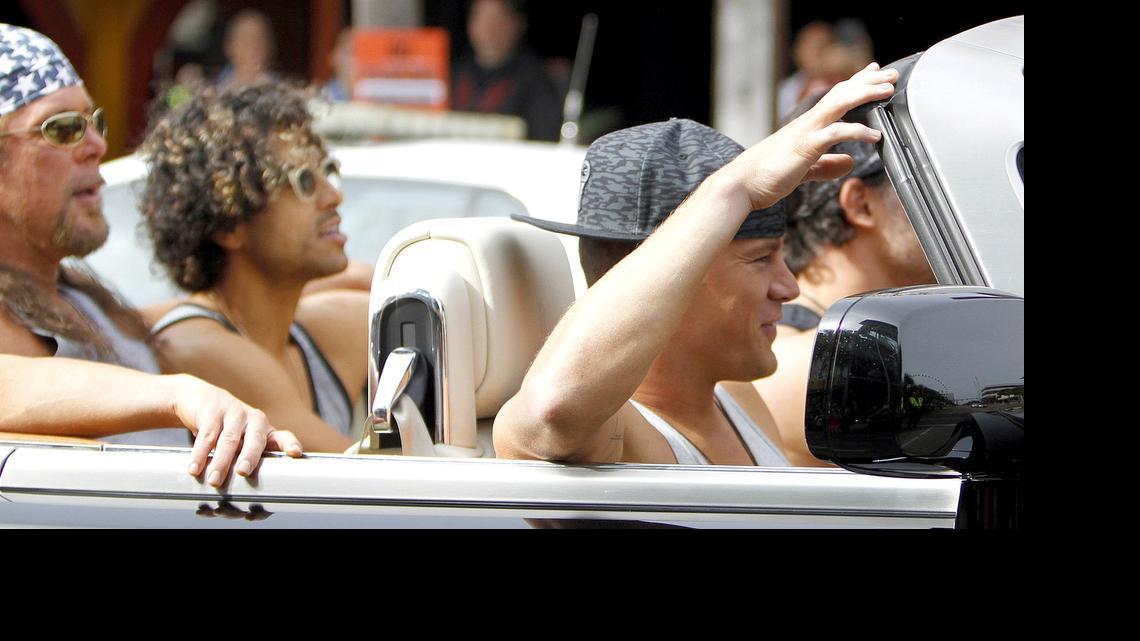 
The stars of "Magic Mike XXL" cruise Ocean Boulevard in a Rolls Royce on Tuesday, Nov. 4, 2014. The actors are Matt Bomer (in the back seat), Kevin Nash (in the middle of the backseat), Adam Rodriguez (behind the driver), Joe Manganiello (driving the car) and Channing Tatum (in the front passenger seat).

