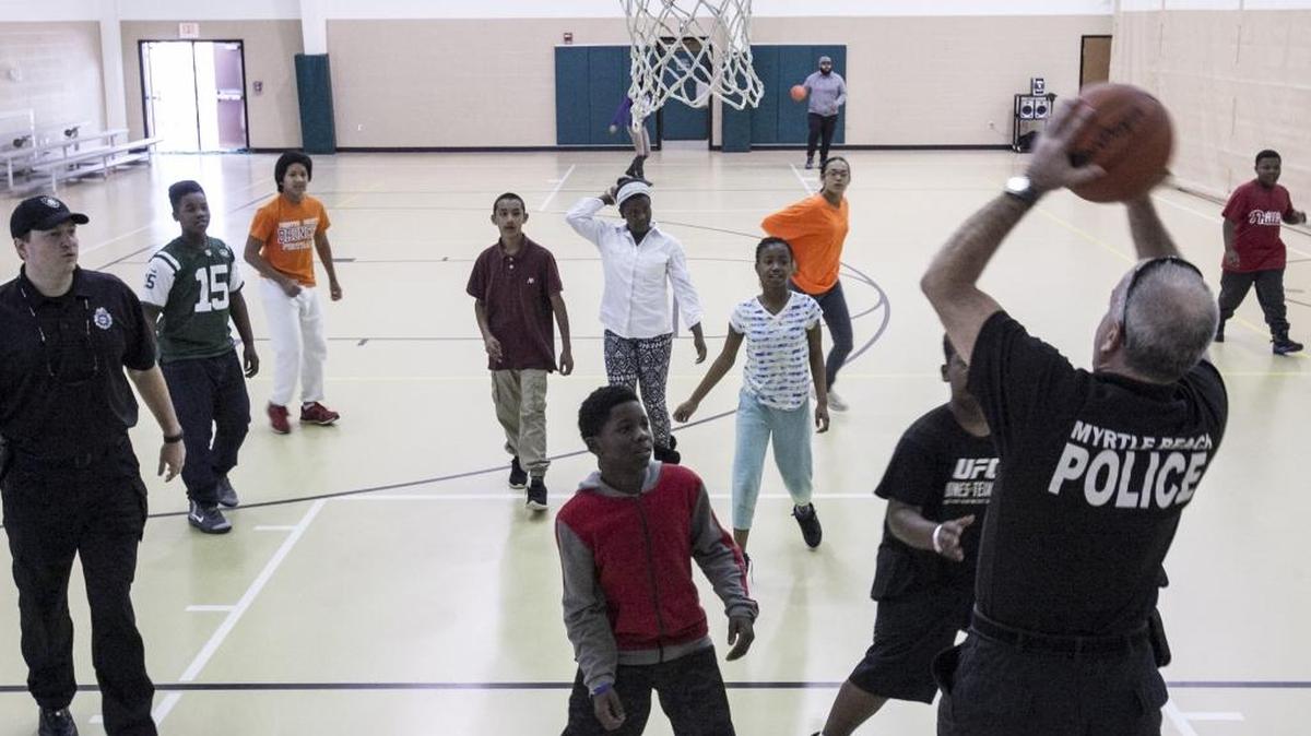 Area youth play basketball with Myrtle Beach police officers during a Gang Awareness and Strategies workshop for youth ages 10 - 16 at the Mary C. Canty Recreation Center on Saturday.