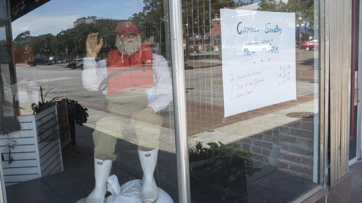 A sign advertises seats on the ark in a store in downtown Georgetown, S.C. 
Residents of Georgetown County are continuing to watch for the forecasted flooding that has not yet arrived. Georgetown officials have reduced estimates for the severity flooding from the waters that has ravaged areas of Horry County. Friday, Sept. 28, 2018.