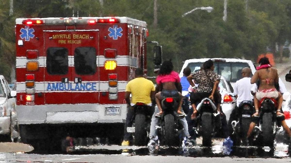 An ambulance leaves the scene of a motorcycle crash during Atlantic Beach Bike Fest in 2013.