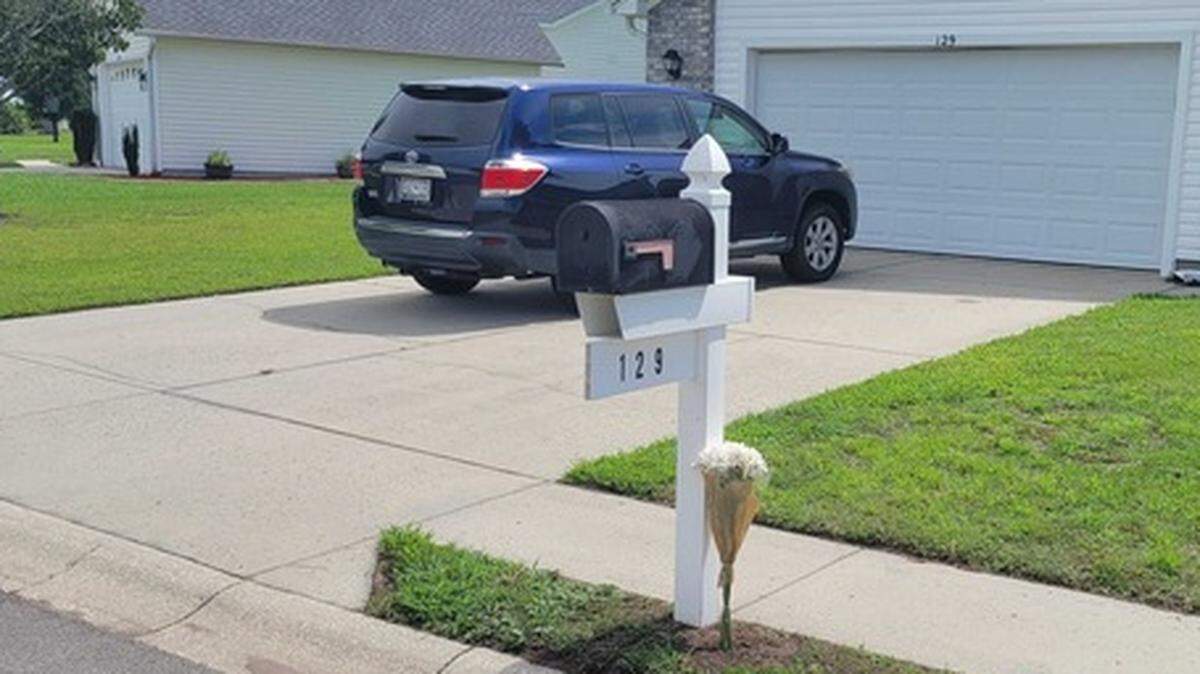 Activity around the home, located on a cul-de-sac about two miles off U.S. 501 in Carolina Forest, was quiet Thursday morning. A lone bouquet of white flowers rests against the family mailbox, placed by a neighbor. Sept. 1, 2022.