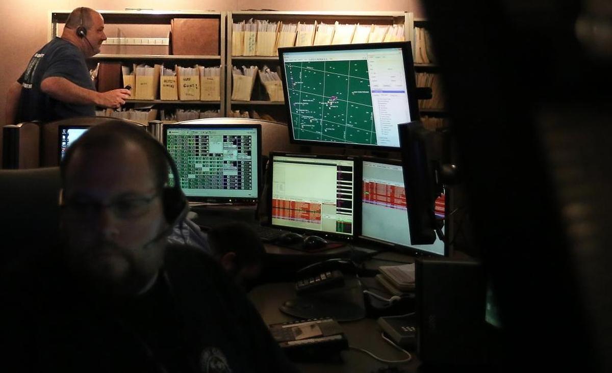 Done with a 12-hour shift, Billy Pavlick has handed over the line and makes his way out of the Horry County 911 call center in Conway on Friday, Sept. 9, 2016. All 911 calls made in the county are answered in the center - including incorporated cities such as Conway, Surfside Beach and Myrtle Beach - and then routed to the proper responders. The center is understaffed by 10 people. In addition to answering life and death calls, they are constantly answering non-emergency calls like questions about directions or complaints about a barking dog.