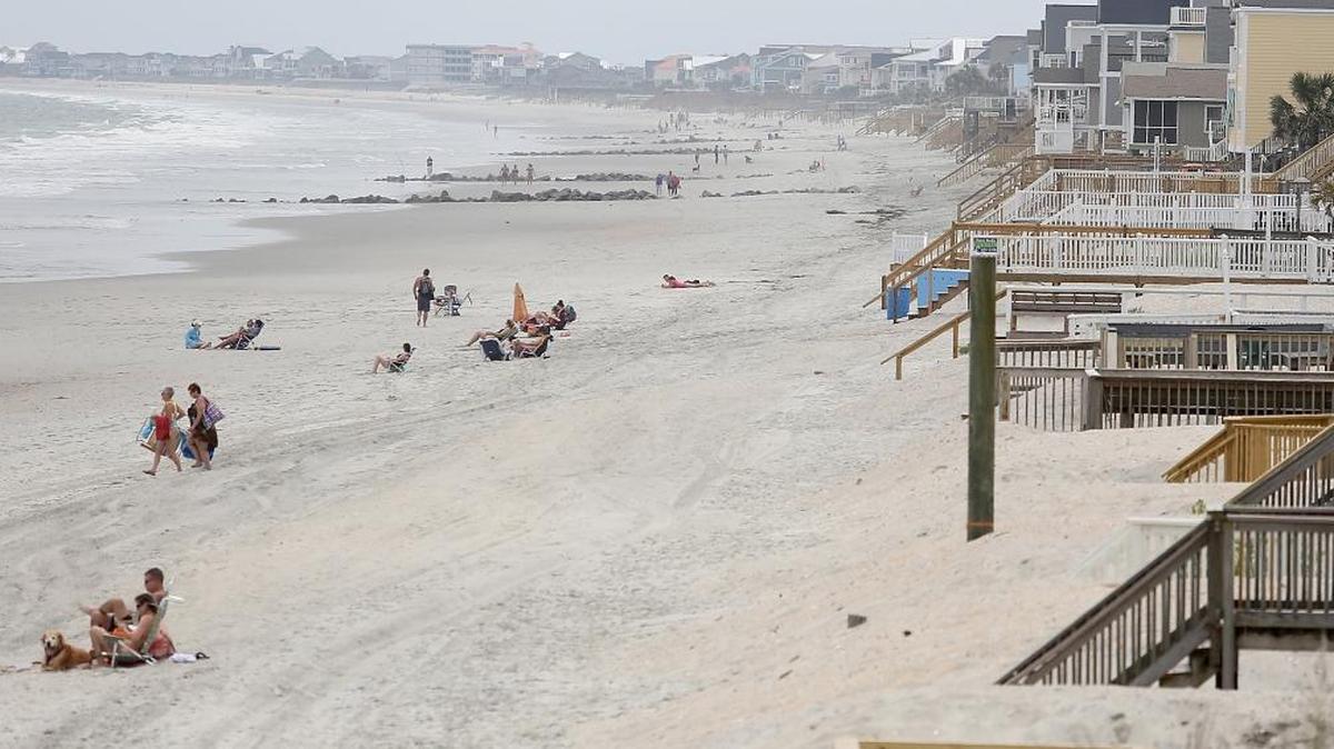 The Garden City Beach dunes are undergoing repairs from storm damage.