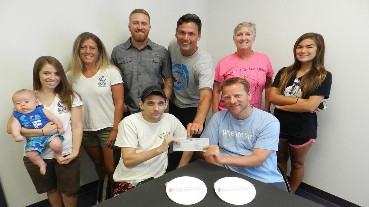 
Left to Right Standing: Asher Samaha (Baby), Ellen Samaha (Adaptive Surf Project), Erin Sharp (Adaptive Surf Project), Brandon Bellegarde (Adaptive Surf Project), Luke Sharp (Coastal Adaptive Sports and Recreation and the Adaptive Surf Project), Melinda Chappell (Coastal Adaptive Sports and Recreation), Zeta Sharp (Cherry Grove Surf Club) Left to Right seated: Chad Oats (Surfer) and Brock Johnson (Founder of Wheel to Surf)
