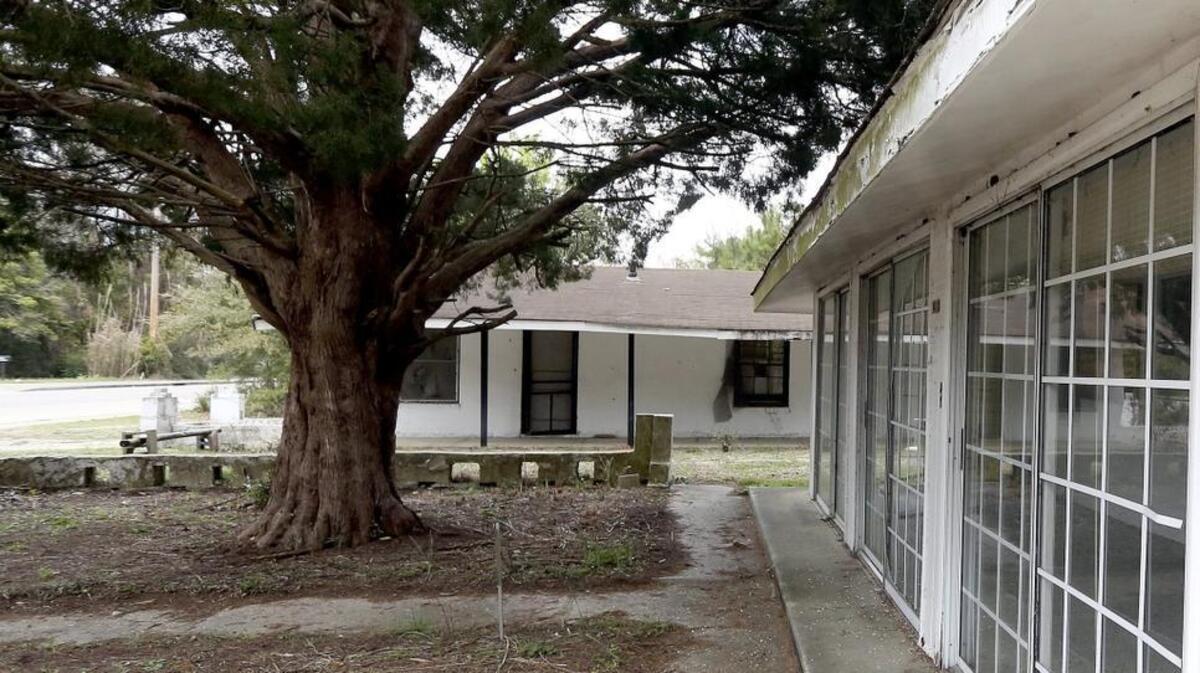 
Herbert Riley and other residents are hoping to work with the city to create a Charlie's Place museum on Carver Street in Myrtle Beach on Friday, March 27, 2015. Charlie's Place was famous for shag dancing and the site of a raid by the Ku Klux Klan in 1950. The site of Charlie's Place is now a vacant lot. Officials had planned to incorporate the former Fitzgerald Motel into the plan, but most of it is beyond repair and will be torn down. 
