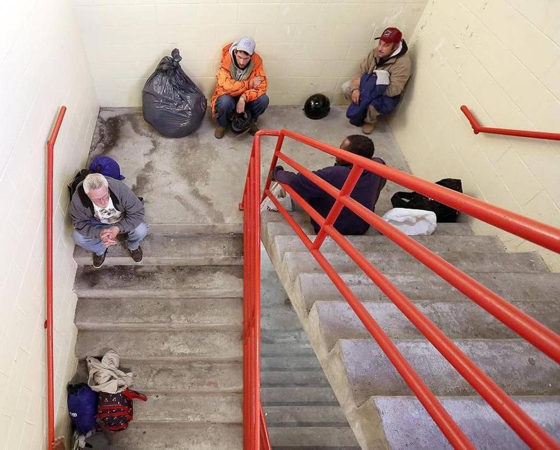 A group of homeless men shelter in the stairwell of the Myrtle Beach parking deck in 2015.