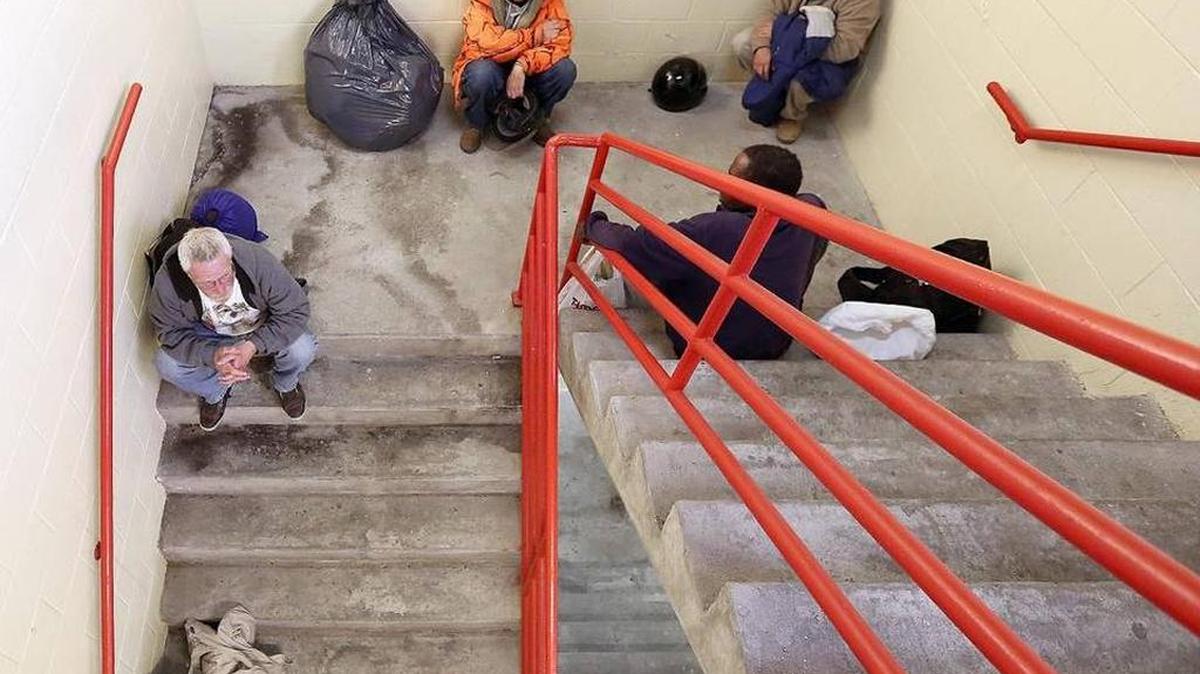 A group of homeless men shelter in the stairwell of the Myrtle Beach parking deck in 2015.
