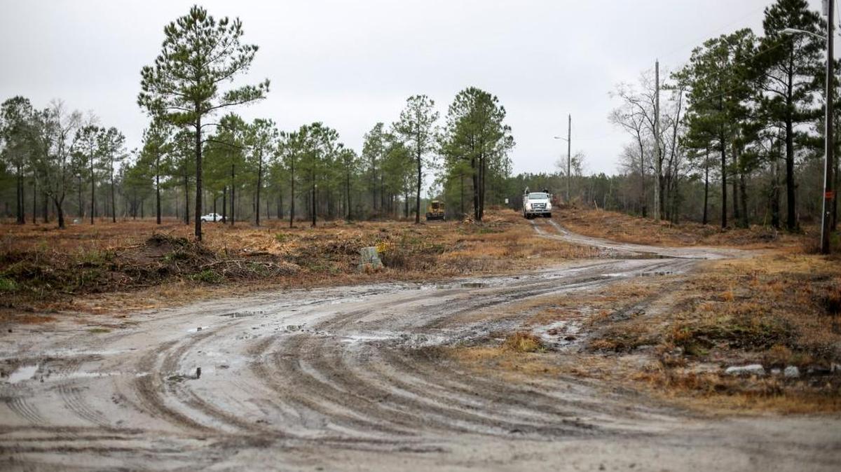 Crews work on land being cleared for a new 1,000-unit development by D.R. Horton called The Parks off Carolina Forest Boulevard.