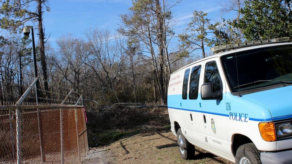 Myrtle Beach scan the woods at the dead end of 27th Avenue North where the body of a young man was found lying face down. The man was dead when an officer discovered him at 11 a.m. Wednesday, Jan. 18, 2017. Officers were in the woods to scan and record the scene on Jan. 19, 2017.