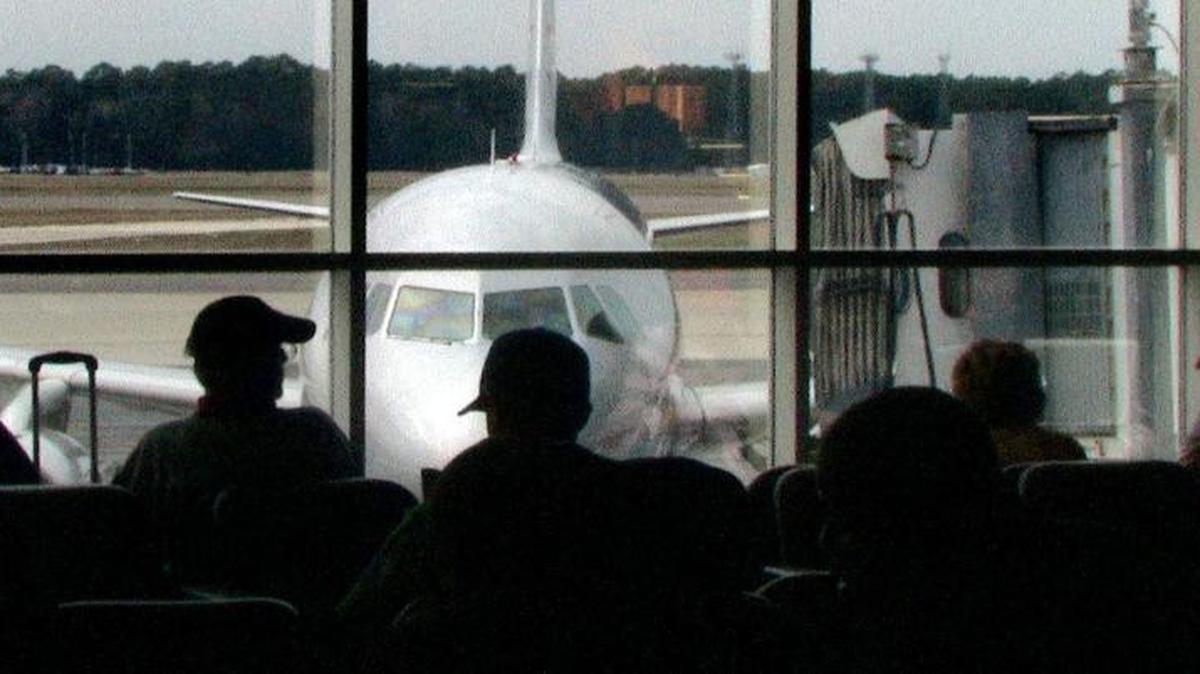 Waiting passengers watch as a Spirit Airlines plane arrives at Myrtle Beach International Airport in this file photo.