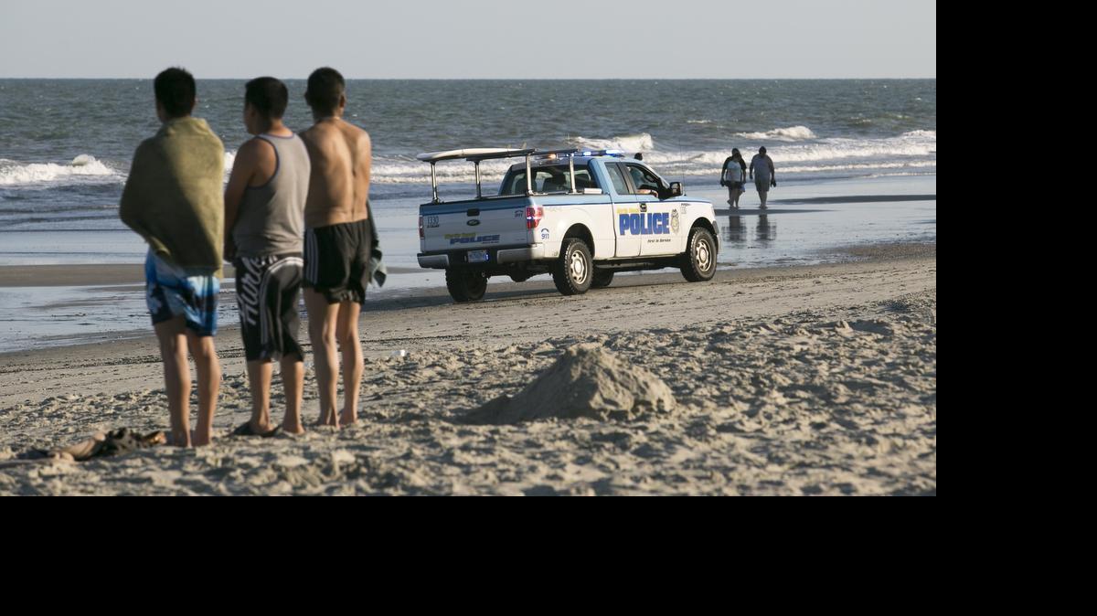 
Myrtle Beach police on the beach after a man nearly drown in May while swimming in the ocean.
