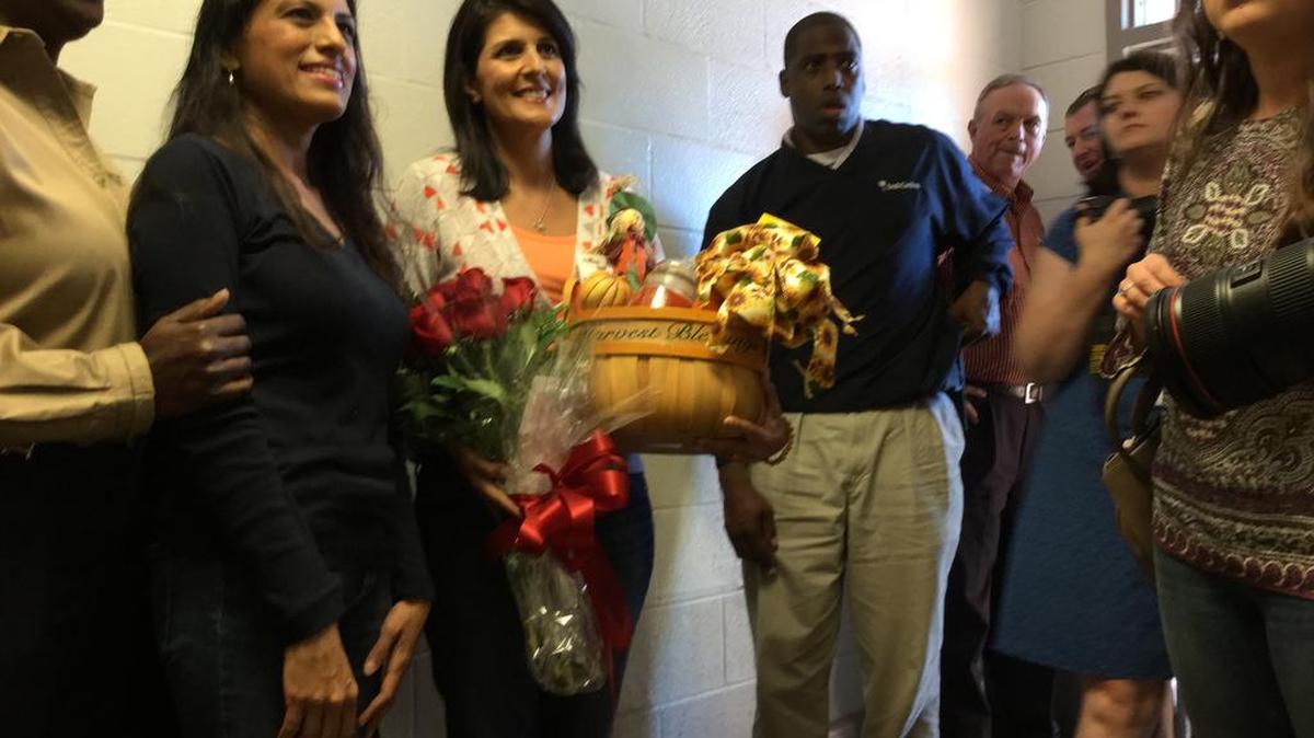 Gov. Nikki Haley and staff greeted by event organizers and flood survivors.