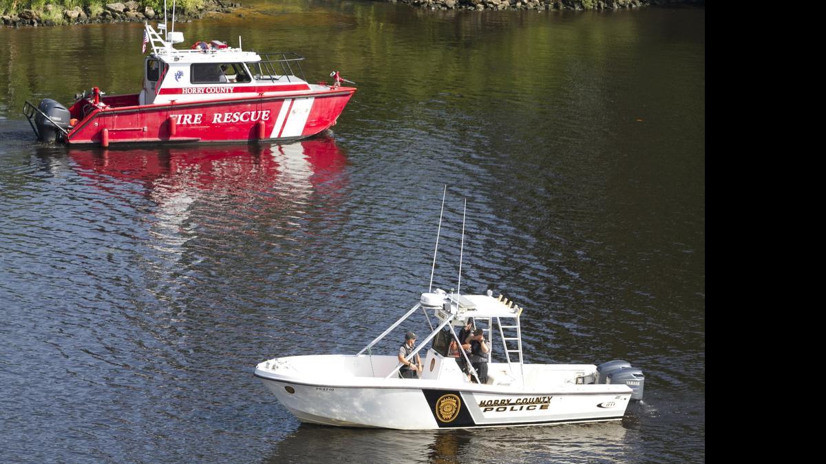 
Rescue crews search for a missing swimmer in the Intercoastal Waterway in front of the Clarion Hotel on Friday afternoon.
