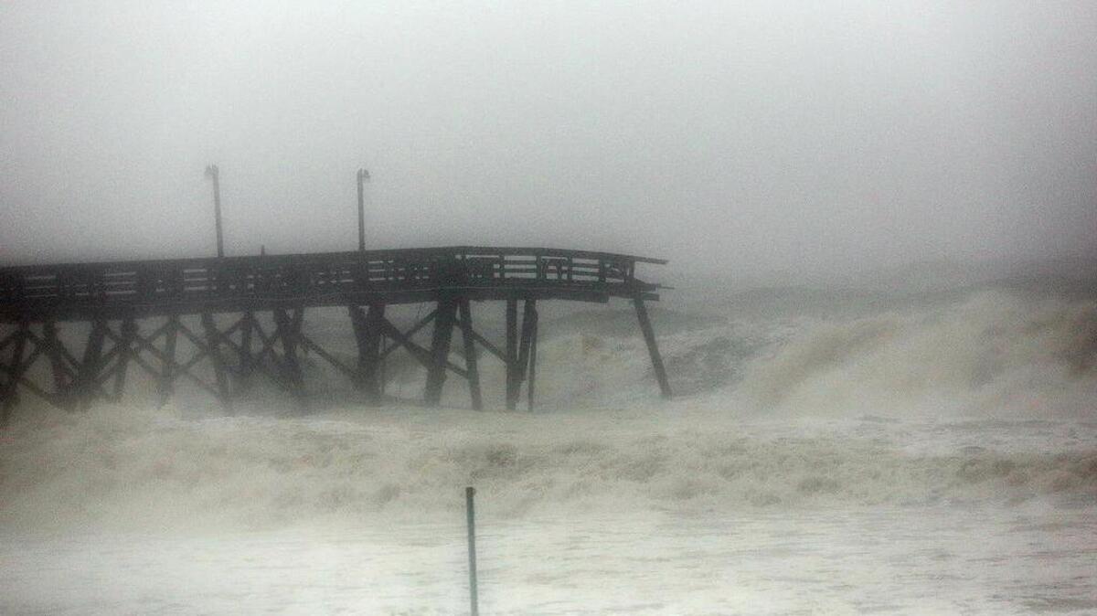 Surfside Beach Pier on Saturday, Oct. 8, 2016, as high tide comes in and Hurricane Matthew goes north.
